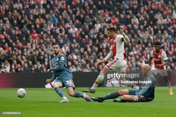 Dusan Tadic of Ajax scores the third goal to make it 2-1 Gernot Trauner of Feyenoord David Hancko of Feyenoord during the Dutch Eredivisie match...