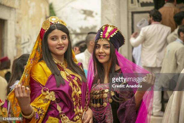 Tunisians wear traditional clothing during the National Day of traditional attire in Tunis, Tunisia, on March 19, 2023. People celebrate the holiday...