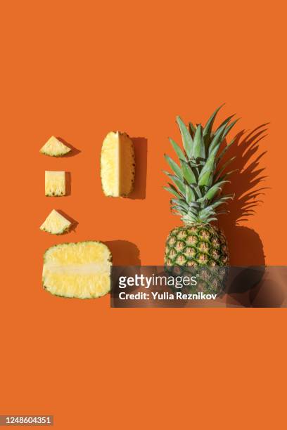 pineapple on the orange background - パイナップル ストックフォトと画像