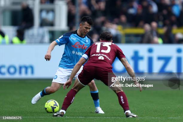 Ricardo Rodriguez of Torino Fc and Hirving Lozano of Ssc Napoli battle for the ball during the Serie A match between Torino FC and SSC Napoli at...