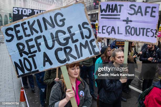 Anti-racist campaigners march from the BBC's Broadcasting House to Downing Street during a Resist Racism demonstration organised by Stand Up To...