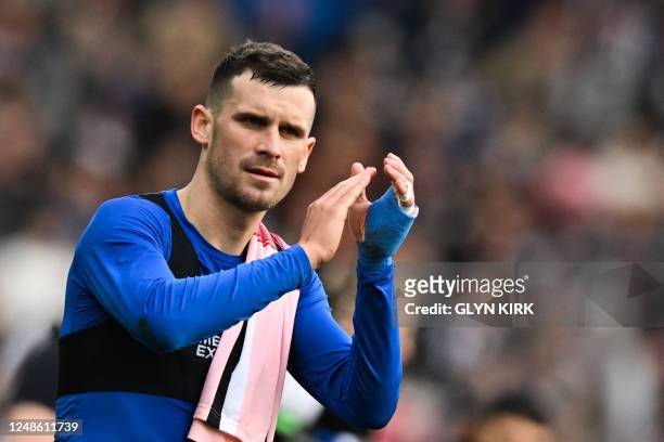 Brighton's German midfielder Pascal Gross applauds as he celebrates at the end of the English FA Cup quarter-final football match between Brighton &...
