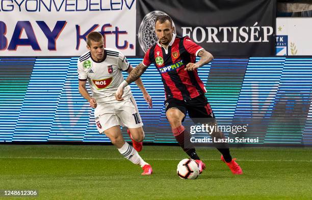 Istvan Kovacs of MOL Fehervar FC competes for the ball with Roland Ugrai of Budapest Honved during the Hungarian OTP Bank Liga match between Budapest...