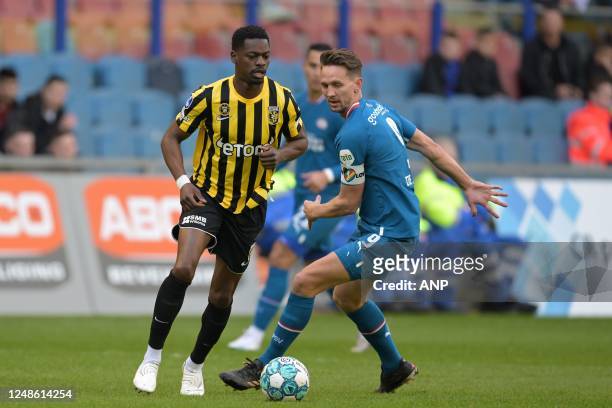 Nicolas Isimat-Mirin of Vitesse, Luuk de Jong of PSV Eindhoven during the Dutch premier league match between Vitesse and PSV at the Gelredome on...