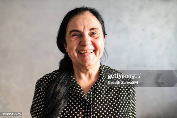 portrait of a beautiful elderly woman smiling - blindness stock pictures, royalty-free photos & images