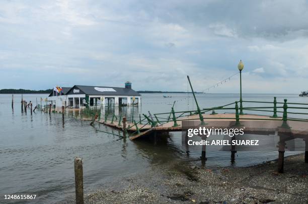 View of a dock destroyed by an earthquake in Puerto Bolivar, Machala, Ecuador, taken on March 19, 2023. - According to an official toll on Sunday,...