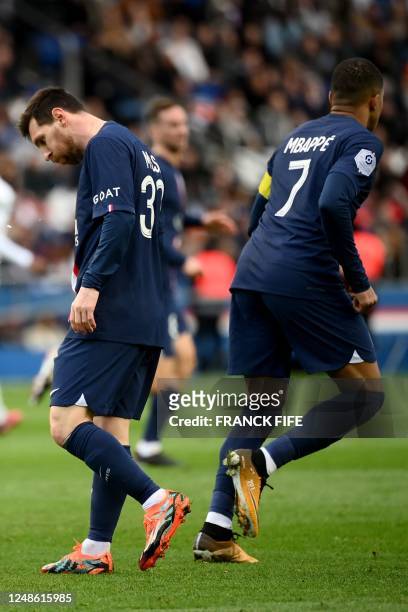 Paris Saint-Germain's Argentine forward Lionel Messi and Paris Saint-Germain's French forward Kylian Mbappe react during the French L1 football match...