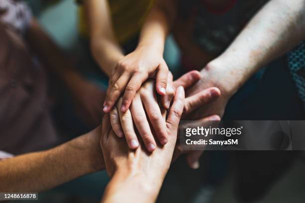 holding hands - support stock pictures, royalty-free photos & images
