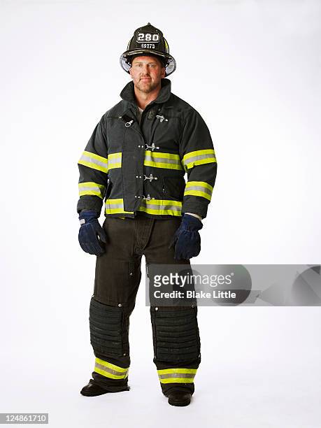 fireman in uniform - fireman stock pictures, royalty-free photos & images
