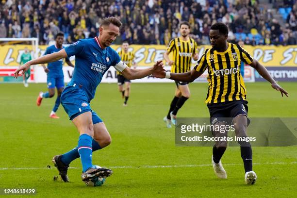 Luuk de Jong of PSV, Nicolas Isimat Mirin of Vitesse during the Dutch Eredivisie match between Vitesse v PSV at the GelreDome on March 19, 2023 in...