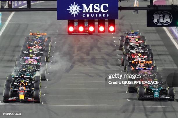 Drivers power up at the starting grid during the Saudi Arabia Formula One Grand Prix at the Jeddah Corniche Circuit in Jeddah on March 19, 2023.