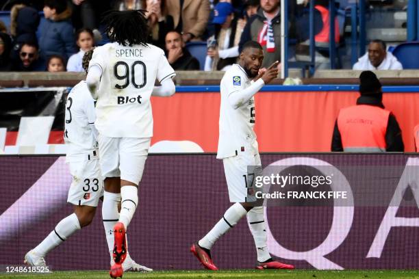 Rennes' Cameroonian forward Karl Toko Ekambi celebrates scoring his team's first goal during the French L1 football match between Paris Saint-Germain...