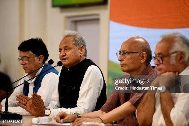 Senior Congress leaders Abhishek Manu Singhvi, Jairam Ramesh, and Rajasthan CM Ashok Gehlot during a press conference at AICC Headquarters, on March...