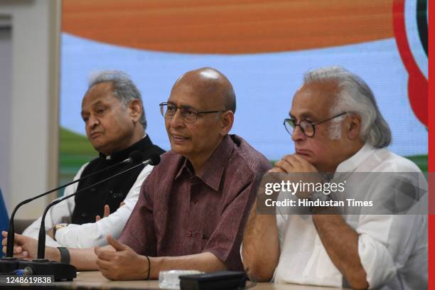 Senior Congress leaders Abhishek Manu Singhvi, Jairam Ramesh, and Rajasthan CM Ashok Gehlot during a press conference at AICC Headquarters, on March...