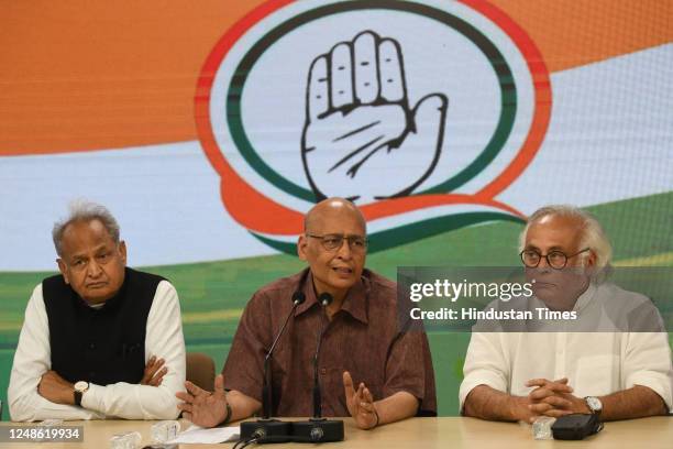 Senior Congress leaders Abhishek Manu Singhvi, Jairam Ramesh, and Rajasthan CM Ashok Gehlot during a press conference at AICC Headquarters, on March...