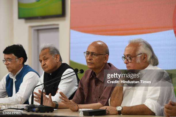 Senior Congress leaders Abhishek Manu Singhvi, Jairam Ramesh, and Rajasthan CM Ashok Gehlot during a press conference at AICC Headquarters, on March...