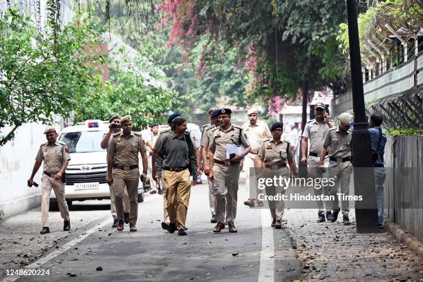 Senior Police personnel outside the residence of Congress leader Rahul Gandhi in connection with a notice issued to him over his remarks during...