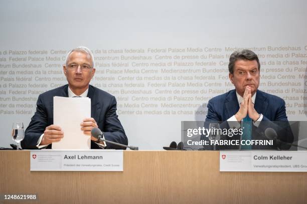 Credit Suisse chairman Axel Lehmann and UBS Chairman Colm Kelleher attend a press conference after talks over UBS taking over its troubled rival...