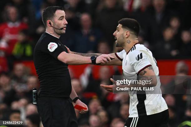 Fulham's Serbian striker Aleksandar Mitrovic argues with English referee Chris Kavanagh and gets himself sent off during the English FA Cup...
