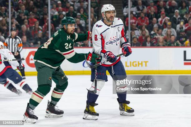 Minnesota Wild defenseman Matt Dumba battles with Washington Capitals left wing Alex Ovechkin during the NHL game between the Washington Capitals and...