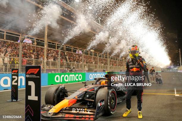 Red Bull Racing's Mexican driver Sergio Perez celebrates after winning the Saudi Arabia Formula One Grand Prix at the Jeddah Corniche Circuit in...