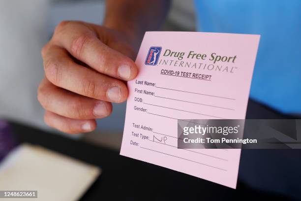 Drug Free Sport International COVID-19 test receipt is displayed at a mobile testing unit prior to the Charles Schwab Challenge on June 09, 2020 in...