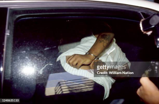 Damian "Football" Williams is arrested by police after he and three others beat Reginald Denny during the 1992 Los Angeles riots on May 12, 1992 in...
