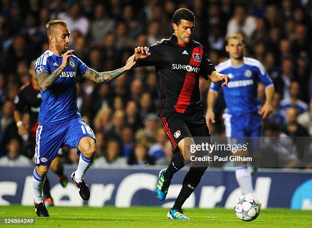 Michael Ballack of Bayer Leverkusen is challenged by Raul Meireles of Chelsea during the UEFA Champions League group E match between Chelsea FC and...