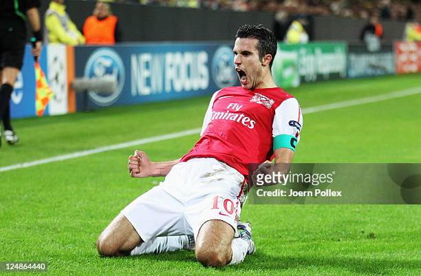 Robin van Persie of Arsenal celebrates after scoring his team's first goal during the UEFA Champions League Group F match between Borussia Dortmund...