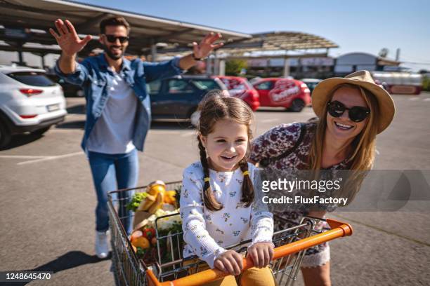 shopping fun - man pushing cart fun play stock pictures, royalty-free photos & images