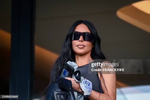 Socialite Kim Kardashian attends to watch the French L1 football match between Paris Saint-Germain and Stade Rennais FC at The Parc des Princes...