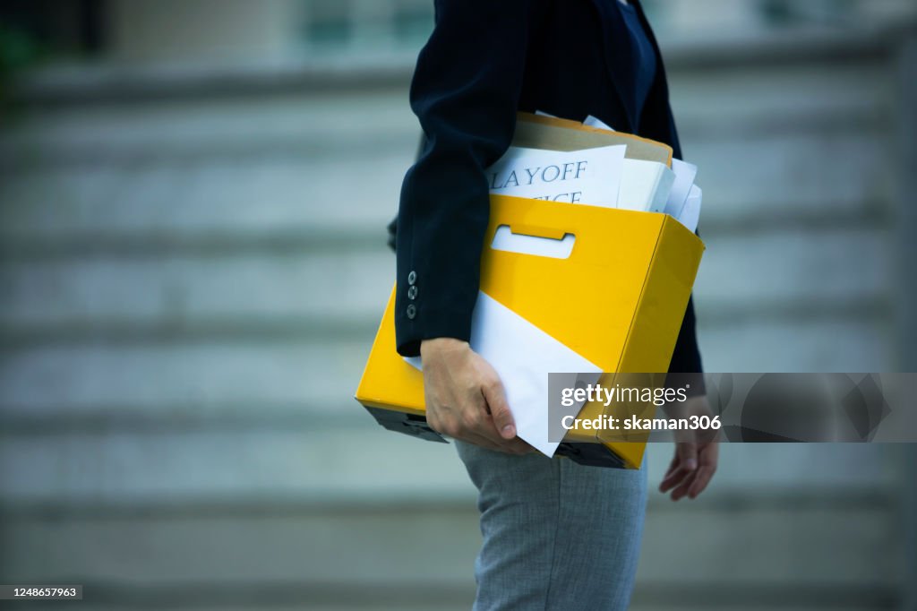 Female office worker feeling sadness and very stress after she get layoff notice after Covid-19 Spread and Covid-19 lockdown Company recession business new normal concept