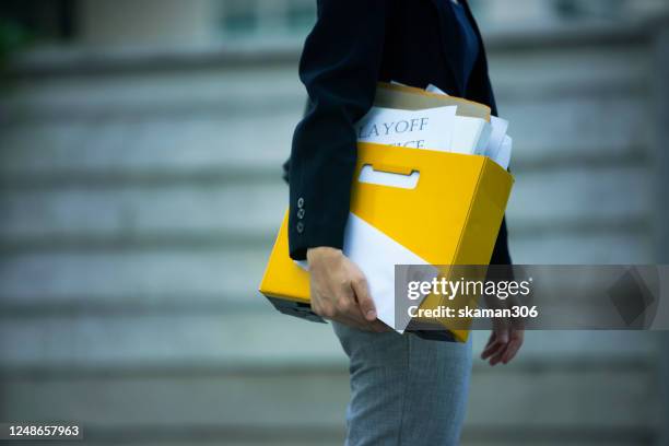 female office worker feeling sadness and very stress after she get layoff notice after covid-19 spread and covid-19 lockdown company recession business new normal concept - unemployment stock pictures, royalty-free photos & images