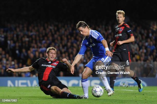 Fernando Torres of Chelsea is tackled by Stefan Reinartz of Bayer Leverkusen during the UEFA Champions League Group E match between Chelsea and Bayer...