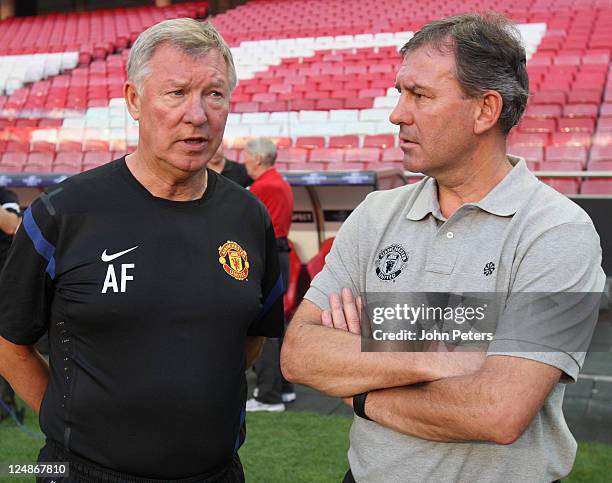 Sir Alex Ferguson and Bryan Robson of Manchester United in action during a first team training session ahead of the UEFA Champions League Group C...