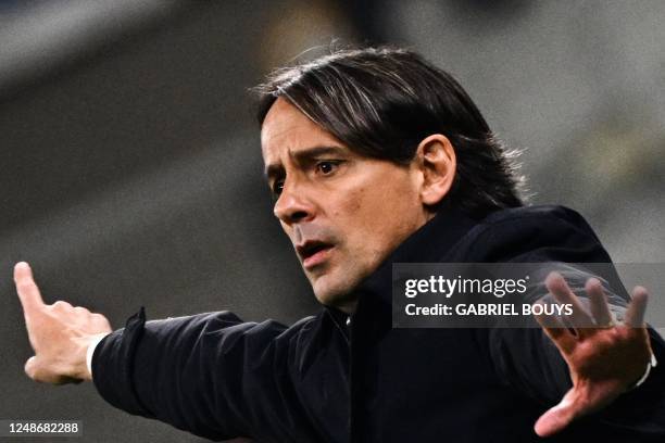 Inter Milan's Italian head coach Simone Inzaghi gives instructions during the Italian Serie A football match between Inter and Juventus on March 19,...