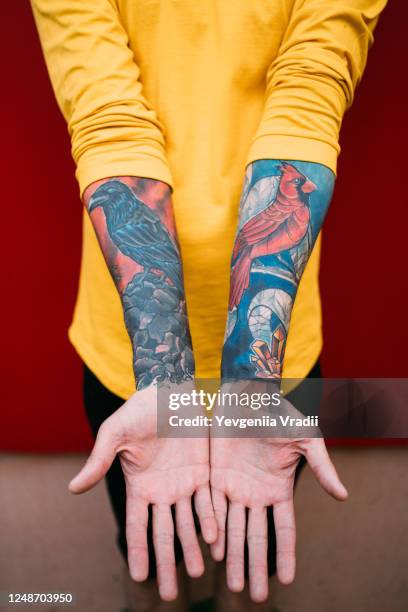 man's hands with tattoos - tattoo art stock pictures, royalty-free photos & images