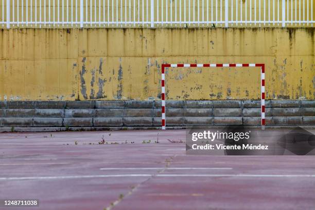 schoolyard with indoor soccer field - urban football pitch stock pictures, royalty-free photos & images