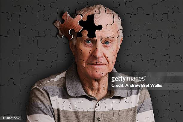jigsaw puzzle, of senior man, falling apart - souvenirs photos et images de collection