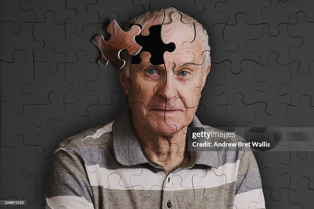 Jigsaw puzzle, of senior man, falling apart