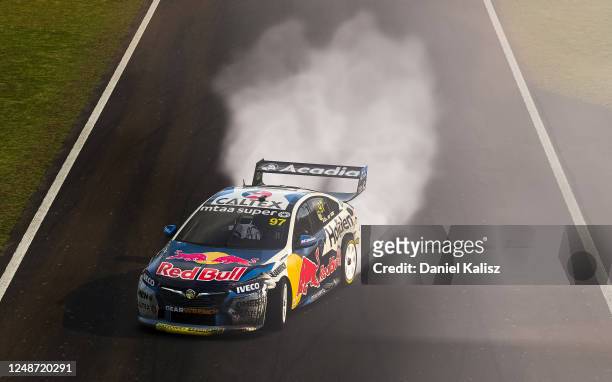 Shane van Gisbergen drives the Red Bull Holden Racing Team Holden Commodore ZB celebrates after winning the Championship during round 10 of the...