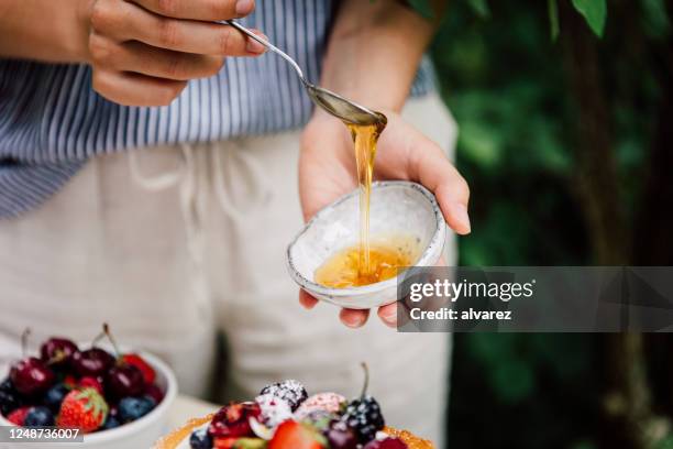 close-up of a woman preparing cake for breakfast - spoon stock pictures, royalty-free photos & images
