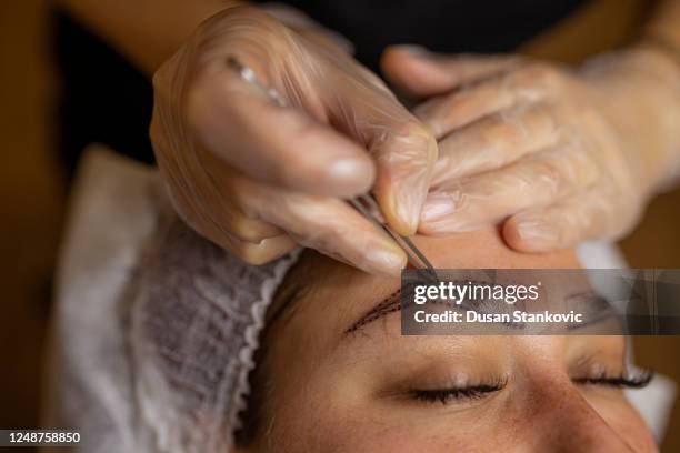 getting ready for permanent make-up treatment - durability stock pictures, royalty-free photos & images