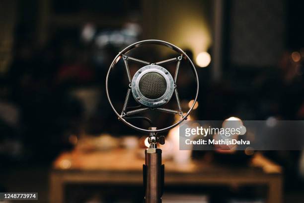 close-up of a professional microphone - old fashioned microphone stock pictures, royalty-free photos & images