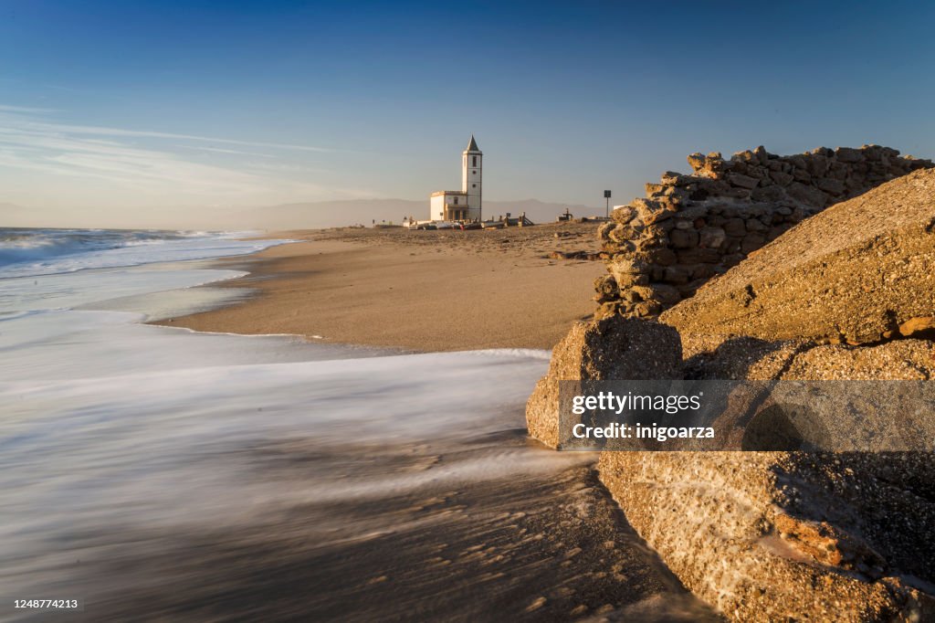 San Miguel church viewed from the beach at Las Salinas, Cabo de Gata-Nijar Natural Park, Almeria Province, Andalucia, Spain