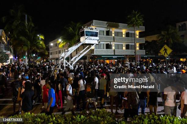 Crowds gather at Ocean Drive and 8th Street during spring break in Miami Beach, Florida, on Saturday, March 18, 2023.