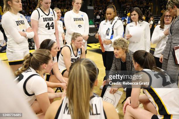 Head Coach Lisa Bluder of the Iowa Hawkeyes talks to her team during a time-out in the first half against the Georgia Bulldogs during the second...