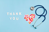 Hearts confetti and text thank you. Expressing gratitude to doctors and nurses