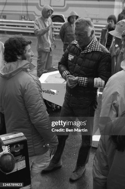 Giovanni Agnelli , head of the family which owns the Fiat Group, talking with race car driver Mario Andretti during a break in Grand Prix racing, May...