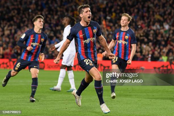 Barcelona's Spanish midfielder Sergi Roberto celebrates after scoring his team's first goal during the Spanish league football match between FC...